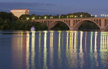 Key Bridge before sunrise in Washington DC, USA. Key Bridge and lights reflection in waters of Potomac River.の写真素材