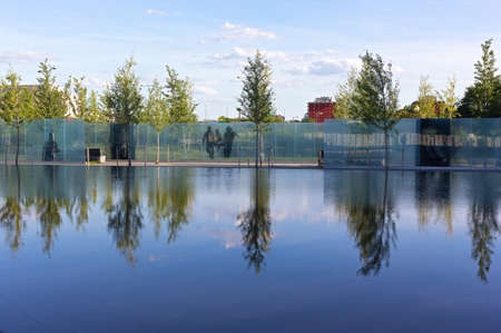 WASHINGTON DC, USA - AUGUST 7, 2016: American Veterans Disabled for Life Memorial dedicated to wounded in combat on August 7, 2016 in Washington DC. Reflection pool and young trees create a calming effect.のeditorial素材