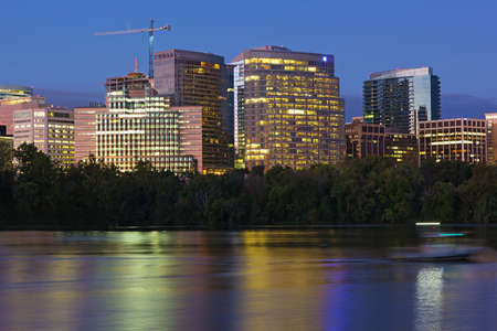 City suburb near Potomac River at dawn in Washington DC, USA. Urban skyline with colorful reflections before the sunrise.の写真素材