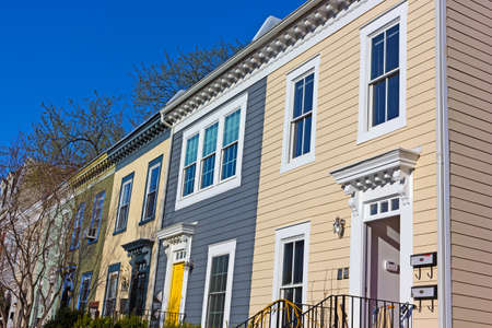 Historic urban architecture of Shaw neighborhood in Washington DC. Colorful residential row houses under bright afternoon sun.の写真素材