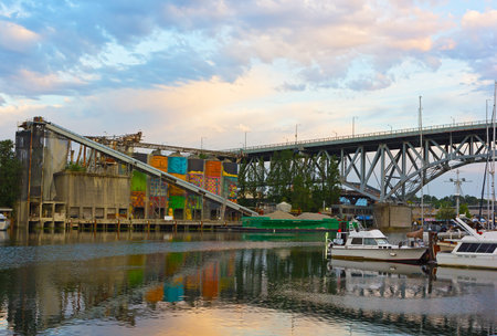 A view on Granville Island with remaining industrial landscape, moored boats and Granville Street...