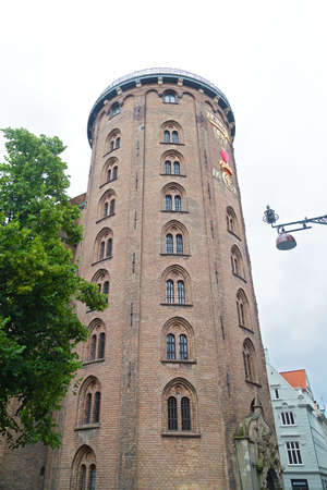 The Rundetaarn (Round Tower) most famous for its equestrian staircase in Copenhagen, Denmark. Round Tower serves as observation deck under cloudy skies.のeditorial素材
