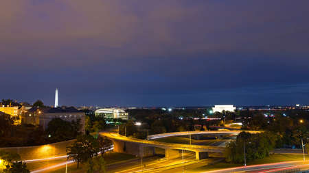 Washington DC night panorama with Lincoln Memorial and National Monument, USA. Brightly lit US capital landmarks in the city landscape at night.の写真素材