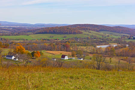 A view on historic site of Sky Meadow State Park in fall, Virginia, USA. Autumn spectacular panorama from a high park vista.の写真素材