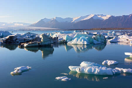 Melting ice in the lagoon, Iceland.  Icelandic spring landscape near the water.の写真素材