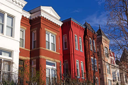 Colorful residential row houses in US capital in spring. Historic townhouses of Shaw neighborhood in Washington DC, USAの写真素材