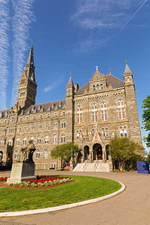 Georgetown University main square with the statue of its founder and Healy Hall on background. Historic university building on the morning of graduation ceremonies.のeditorial素材