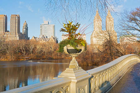 A view on Manhattan from the Bow bridge in Central Park, New York City. Tranquil winter morning near The Lake in Central Park.の写真素材