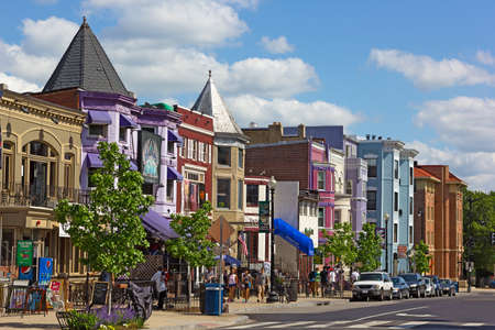 WASHINGTON DC, USA â MAY 9, 2015: Row houses and businesses in Adams Morgan neighborhood on a perfect spring day with young people walking on the street.のeditorial素材