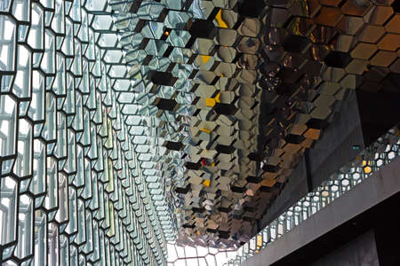 REYKJAVIK, ICELAND  MAY 2, 2017: Majestic glass wall and mirrored ceiling of the Harpa Concert Hall interior.のeditorial素材
