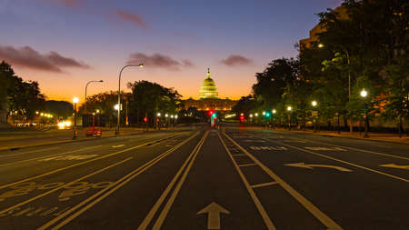 US Capitol building at dawn as seen from Pennsylvania Avenue. Colorful sunrise along Pennsylvania Avenue in Washington DC.のeditorial素材