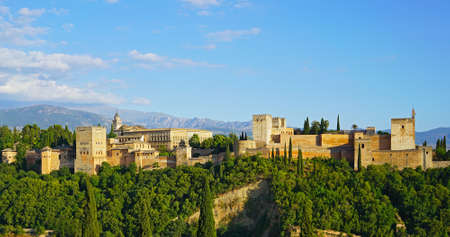 The Alhambra palace and fortress at sunrise hour, Granada, Spain. Ancient Arabic fortress with Sierra Nevada mountains on horizon in Andalusia, South Spain.のeditorial素材