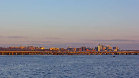 Washington DC panorama across Potomac River at sunrise. Transport artery connecting downtown with Virginia suburbs of metropolitan area.の写真素材