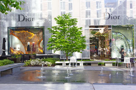 WASHINGTON DC, USA â May 9, 2018: Dior shop at City Center DC is located in a quiet pedestrian alley. Shop windows decoration on a canvas of modern buildings architecture.のeditorial素材