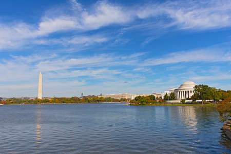 Washington DC panorama in autumn with Thomas Jefferson Memorial and Washington Monument. The Tidal Basin landscape in fall under high cloudy skies.のeditorial素材