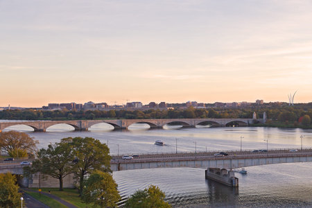 Washington DC panorama with bridges across Potomac River at sunset. Scenic view on US capital...