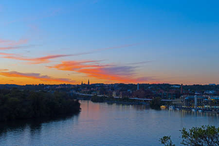 Bright autumn sunset over Georgetown waterfront in Washington DC, USA. Urban US capital panorama along Potomac River.の写真素材