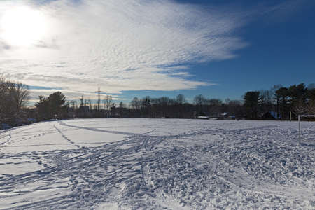 Soccer field in winter after the snowstorm past. Winter activity on the soccer field covered by snow.の写真素材