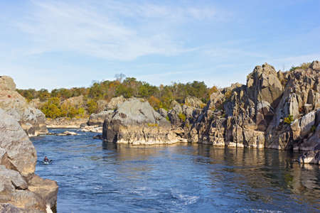 Recreational sport activities at a scenic river turns in Great Falls park, Virginia, USA. Mountainous riverbanks and rapids on Potomac River in autumn.の写真素材