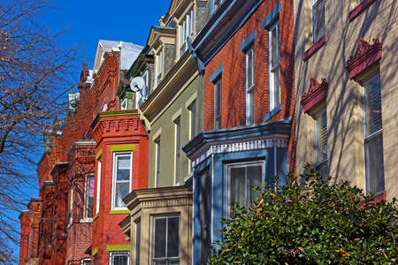 Historic residential townhouses in Washington DC suburb on a bright winter day. Row houses in close proximity to the city downtown.の写真素材