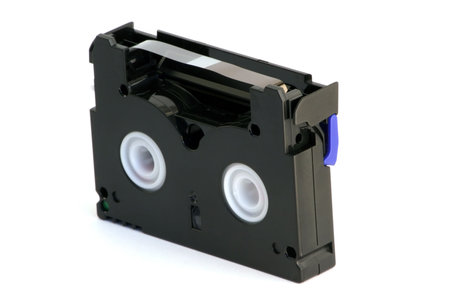 MiniDV Cassette opened with magnetic strip on white background