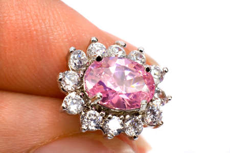 Fingers holding a beautiful Jewel ISOLATEDの写真素材