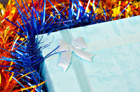 Christmas gift with ribbon on decorationsの写真素材