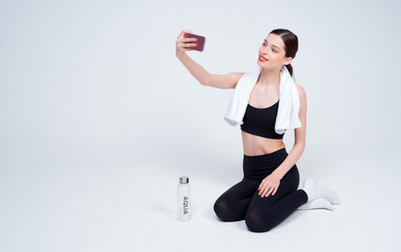 Sporty slim by lovely serious blue-eyed young boxer posing, sports Caucasian woman isolated over...