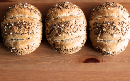 Tasty freshly baked pastry with linseed and sunflower seeds. Top view, copy space, selective focus....