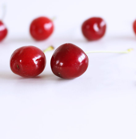 Detail of ripe fresh, organic juicy cherries isolated on white background. Highly nutritious fruit,...
