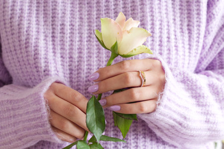 Knitted sweater in trendy Color of The Year 2022 Very Peri purple violet color.の写真素材
