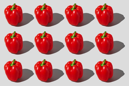 Colorful pattern of bell peppers on gray background. view from top. High quality photo.の写真素材