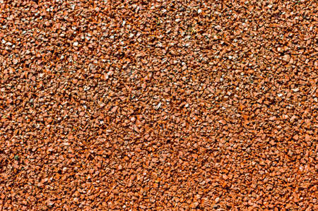 small stones of red color as the backgroundの写真素材