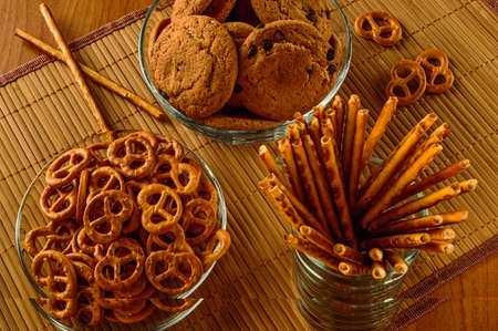 oatmeal cookies, pretzels, bread sticks in a glass container for teaの写真素材