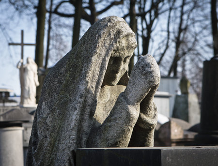 Mourning Virgin statue on a tombstone at the 18th century Necropolis