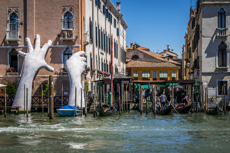 The contemporary sculpture of giant hands was unveiled during the opening of the 2017 Venice Biennale, Italy.のeditorial素材