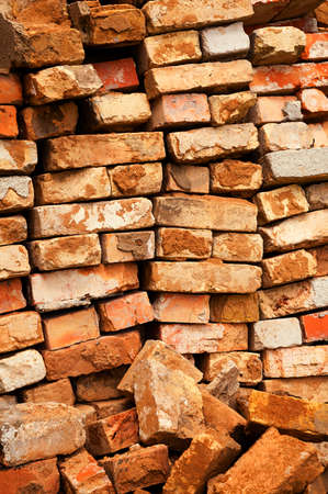the piled old bricks of red color. were used for constructionの写真素材