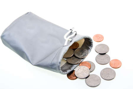 coins in a silver bag. isolated on whiteの写真素材