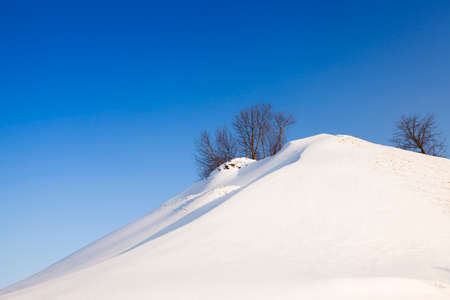 the small height which has been completely covered with snowの写真素材