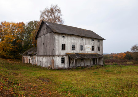 an old wooden abandoned mill white color. Belarusの写真素材