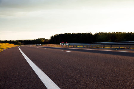 a small asphalt road, located outside of the village