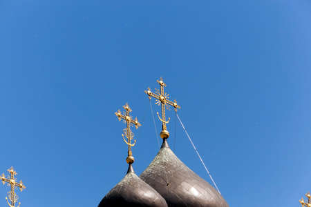 photographed by a dome with a cross Orthodox church located on the territory of the Republic of Belarus. the sky flies poplar fluffの写真素材