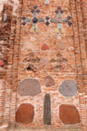 photographed close-up of the old church, crumbling wall, defocused