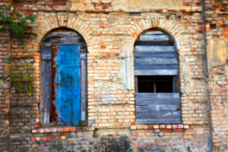 boarded up window in an old abandoned building, close-up, Defocusの写真素材