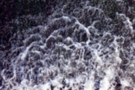 photographed close-up of the old wooden dam, which formed holes flowing dam defocus