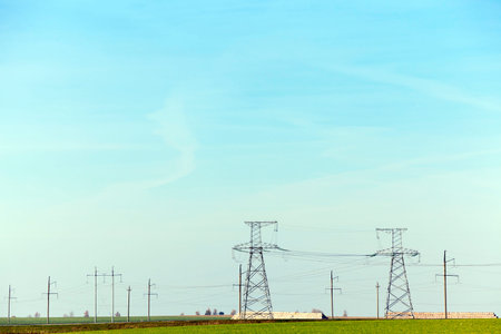 photographed close-up, high-voltage electric poles located in the countryside