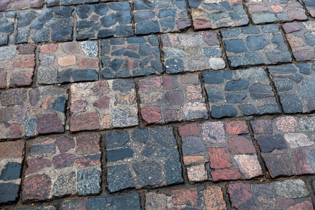 photographed close-up wet road made of stone, after the rain,