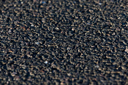 photographed close-up of the new road for the movement of vehicles, a dark cover the carriageway,の写真素材