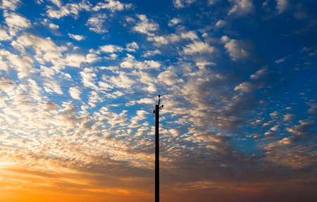 photographed close-up, high-voltage electric poles located in the countrysideの写真素材