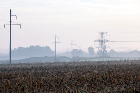 photographed electric poles located in the field, night, dusk and sunset, industry,の写真素材